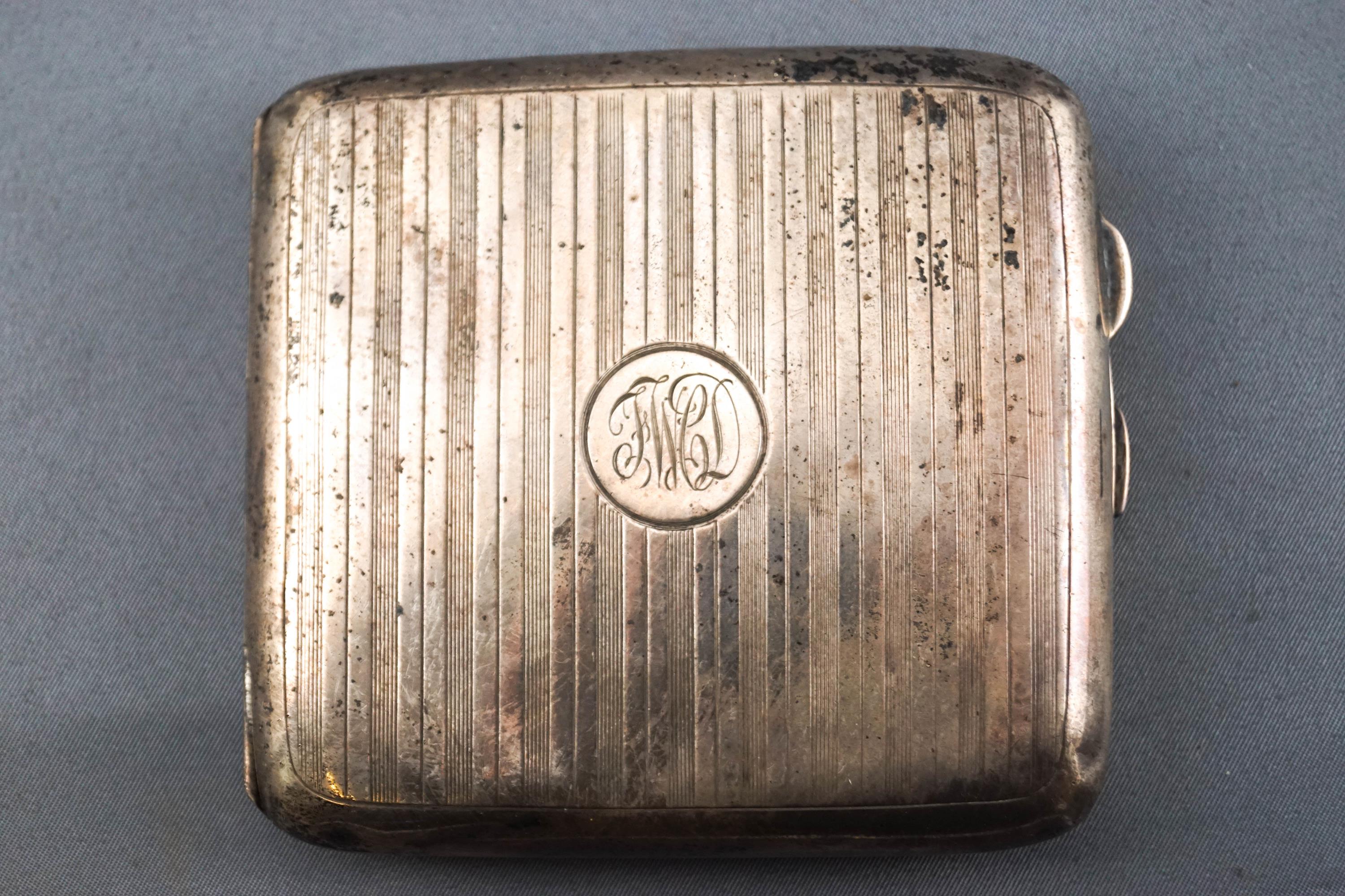 A plain rectangular form engine turned silver cigarette case, with gilt interior, Garrard & Co,