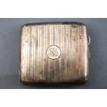 A plain rectangular form engine turned silver cigarette case, with gilt interior, Garrard & Co,