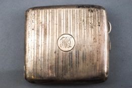 A plain rectangular form engine turned silver cigarette case, with gilt interior, Garrard & Co,