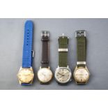 A collection of seven dress watches all fitted with leather or fabric straps.
