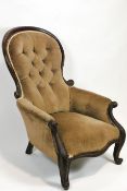 A Victorian mahogany show wood frame armchair with button back on cabriole legs,