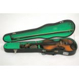 A "Blessing" brand make one piece back violin and bow in a hard case