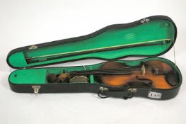 A "Blessing" brand make one piece back violin and bow in a hard case