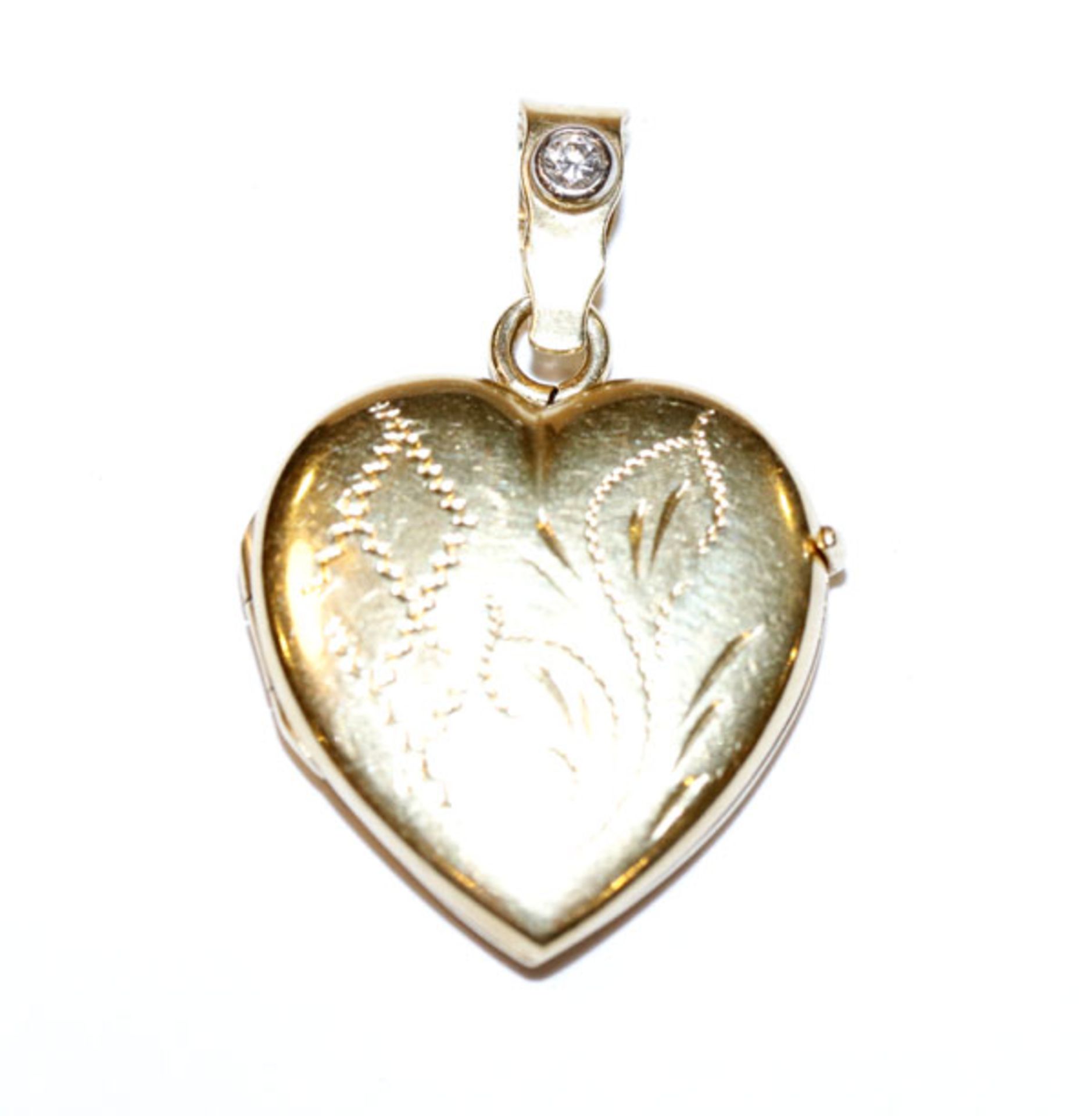 18 k Gelbgold Medaillon-Herzanhänger, fein graviert und mit einem Diamant besetzt, aufklappbar, H