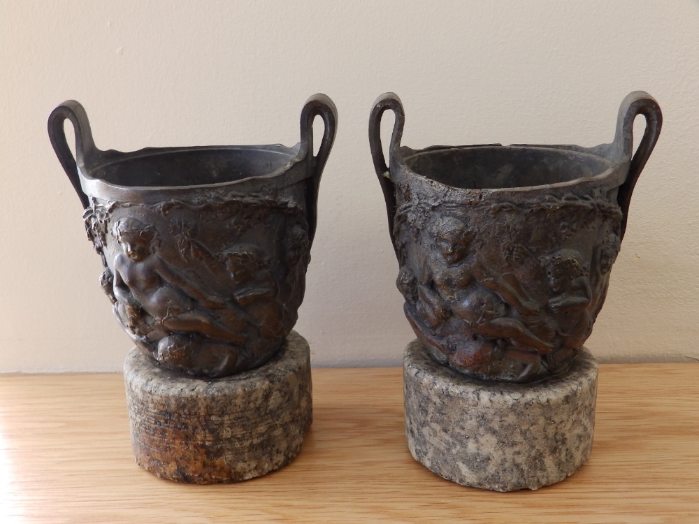 A pair of 19thC Renaissance revival bronze urns on stone bases, 6.75” high. (2) - Image 2 of 3