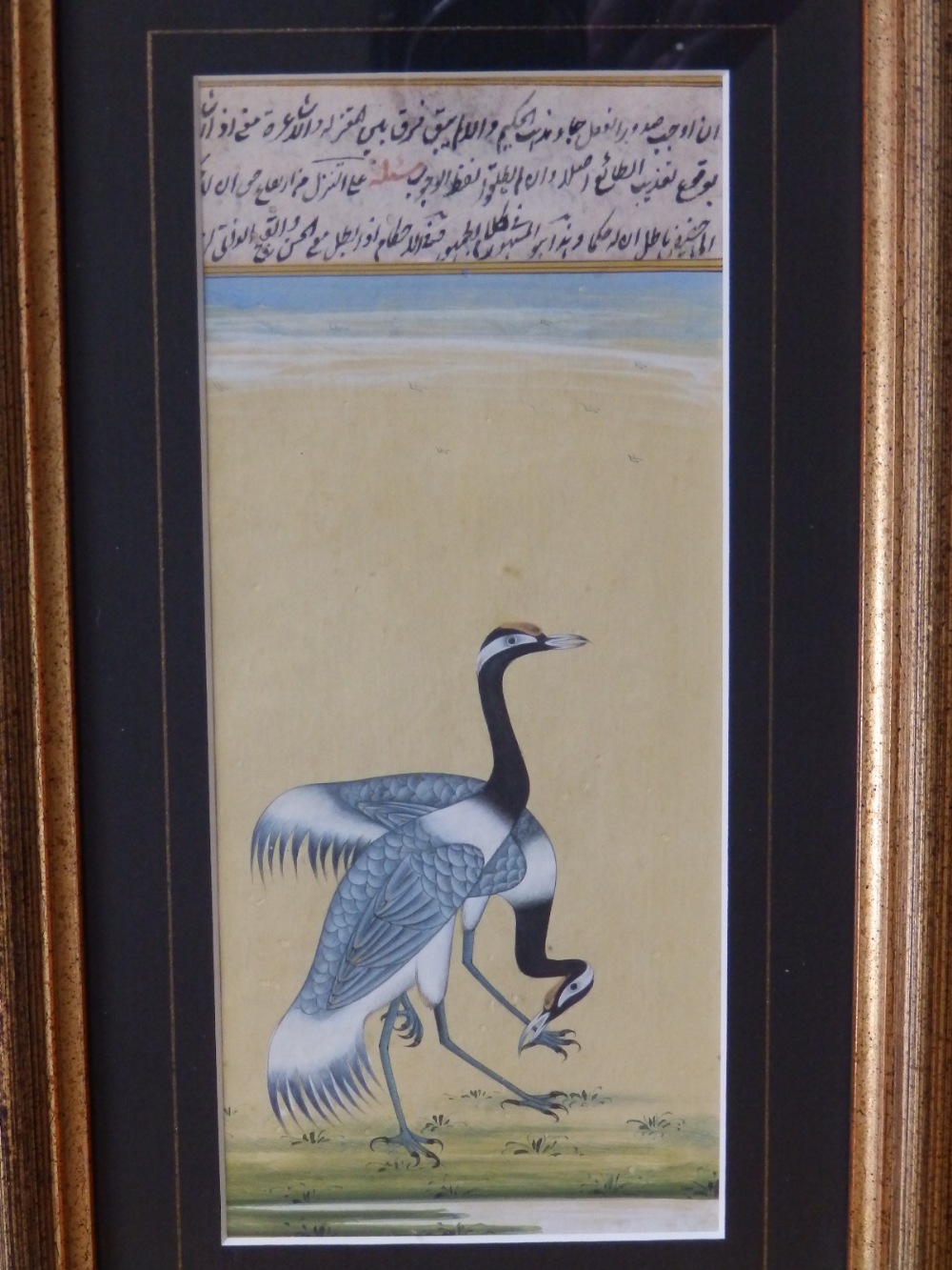 A 19thC Persian watercolour with bodycolour – Two cranes with extensive inscription above, 8” x 3.5”