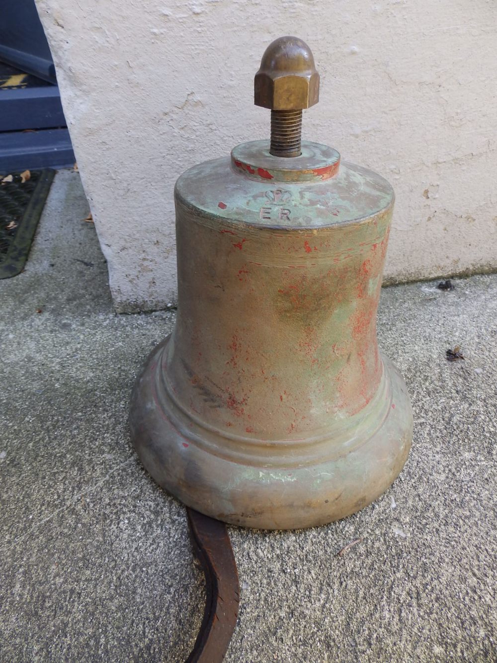 A 20thC bronze bell - ER, 8.5” high.