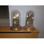 Two brass 'anniversary' clocks under domes – one dome plastic.