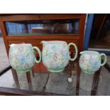 A set of three Shelley 'Melody' chintz pattern graduated jugs.