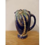 A Beswick dark blue glazed palm tree jug - 1074.