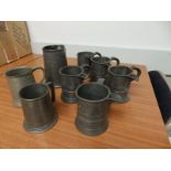 Five Victorian side-spouted pewter pint measures, with indistinct inscriptions to sides '… Leonard's