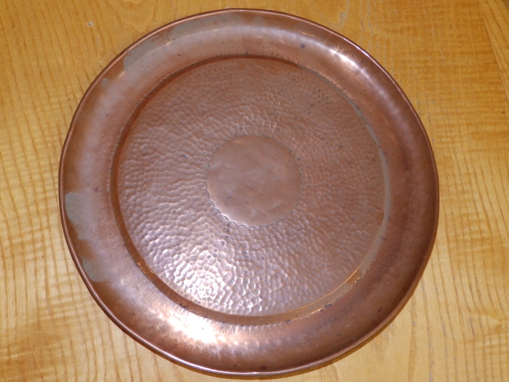 An embossed brass alms dish, 14" together with a beaten copper circular tray by H. Dyer, 11.5". (2) - Image 3 of 4