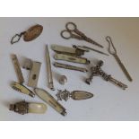 Three mother-of-pearl handled folding pen knives, two silver thimbles, two babies' rattles and other