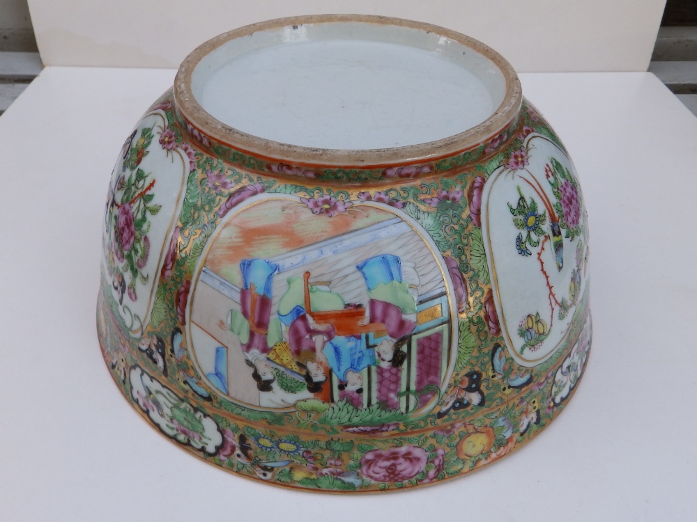 A 19thC Cantonese porcelain punch bowl, decorated with panels depicting butterfies and figures on - Image 5 of 5