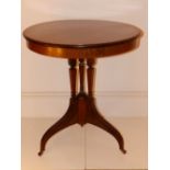 A late Victorian/Edwardian inlaid mahogany circular tripod table, supported on square section triple