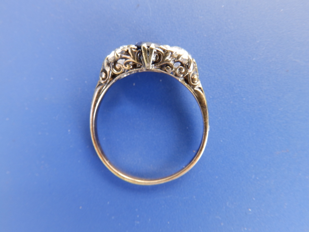 A three stone sapphire & diamond ring, the cushion cut sapphire flanked by two old cut diamonds - Image 2 of 3