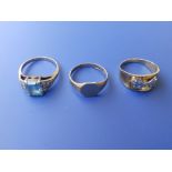 A 9ct gold signet ring and three other rings. (4)