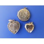 Two heart-shaped 9ct lockets and one other (3)