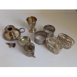 A London silver egg cup, two pairs of EP grape scissors, two pairs of napkin rings, a small