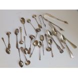 20 silver tea, salt, mustard spoons and others, two pairs of tongs and a pickle fork. (23)