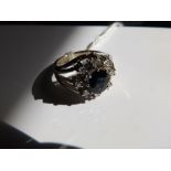 A modern sapphire & diamond cluster ring .585. Finger size K/L.