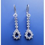 A pair of sapphire & diamond pear shaped drop earrings in white metal , 1.25".
