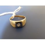 A gent's diamond band ring - '18K'. Finger size T.