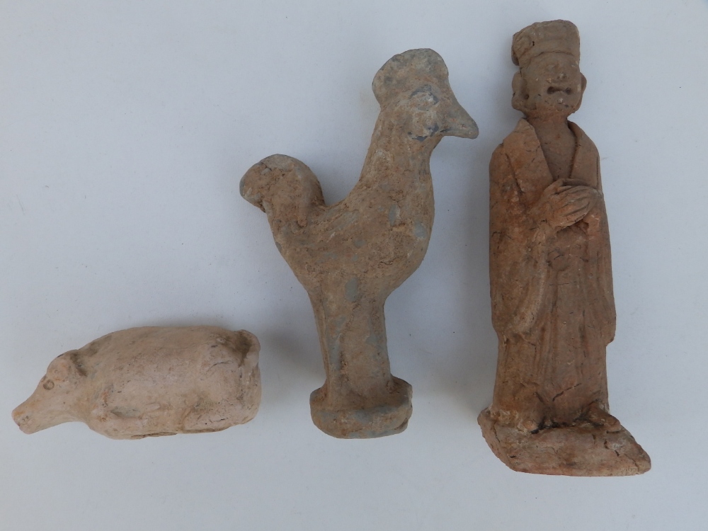 Three ancient Chinese pottery tomb figures, the largest a standing male, 7" high.