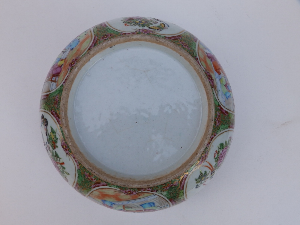 A 19thC Cantonese porcelain punch bowl, decorated with panels depicting butterfies and figures on - Image 3 of 5