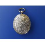 A Victorian oval locket containing mounts for four photos to the decorated interior, 1.6".