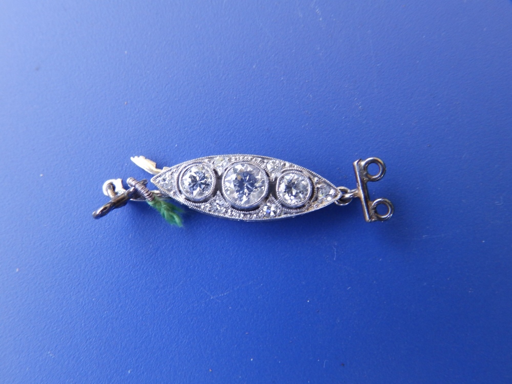 An early 20thC diamond set white metal clasp - ex necklace.