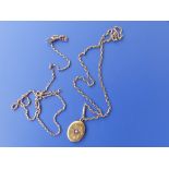 Two yellow metal necklace chains and an oval locket. (3)