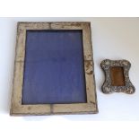 A silver photo frame with waved rim - S.O. & Co., Birmingham 1908, 10" high and a small photo