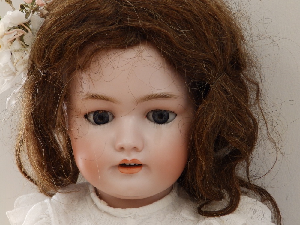 A late 19thC Simon & Halbig bisque head girl doll 1078 size 13, having pierced ears, blue sleeping - Image 2 of 3