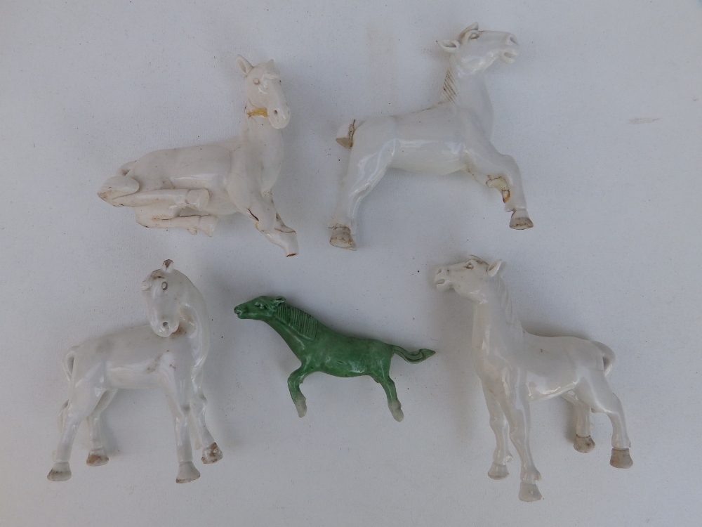 A Chinese white glazed porcelain horse, 3.5" high and four other damaged horses. (5) - Image 2 of 2