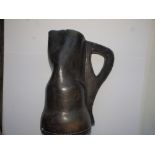 An old stitched leather 'blackjack' jug, 11.5".