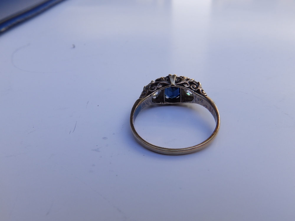 A three stone sapphire & diamond ring, the cushion cut sapphire flanked by two old cut diamonds - Image 3 of 3