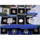 12 cases containing individual GB Proof silver coinage.