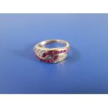 A modern ruby & diamond set 18ct gold band ring.