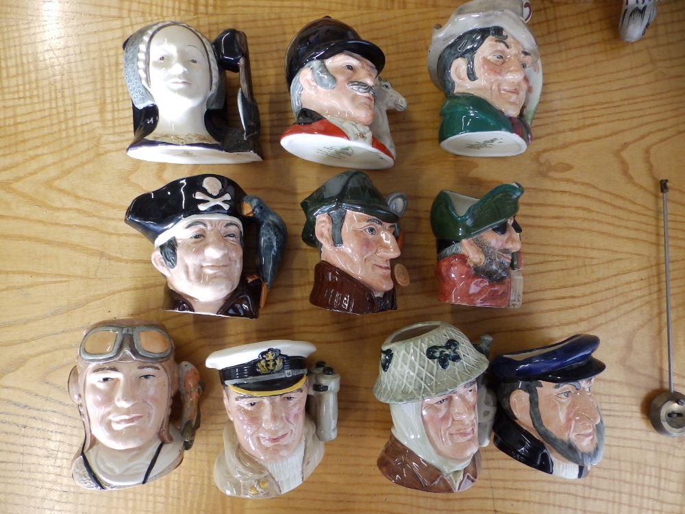 10 small Royal Doulton character jugs.