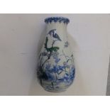 A 20thC Oriental porcelain vase painted birds & flowering plants, 9.5" high.
