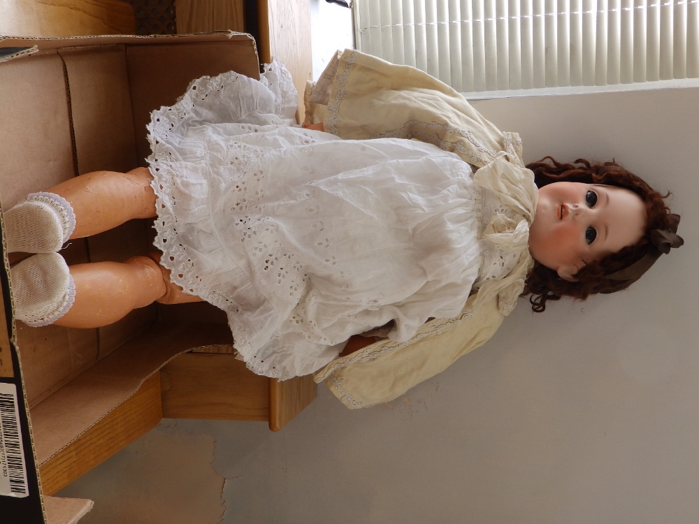 A large Bergmann bisque head girl doll, size 17 - head cracked.