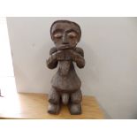 An African carved wood fertility figure, 15" high.