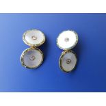 A pair of mother-of-pearl & diamond set 18ct cufflinks.