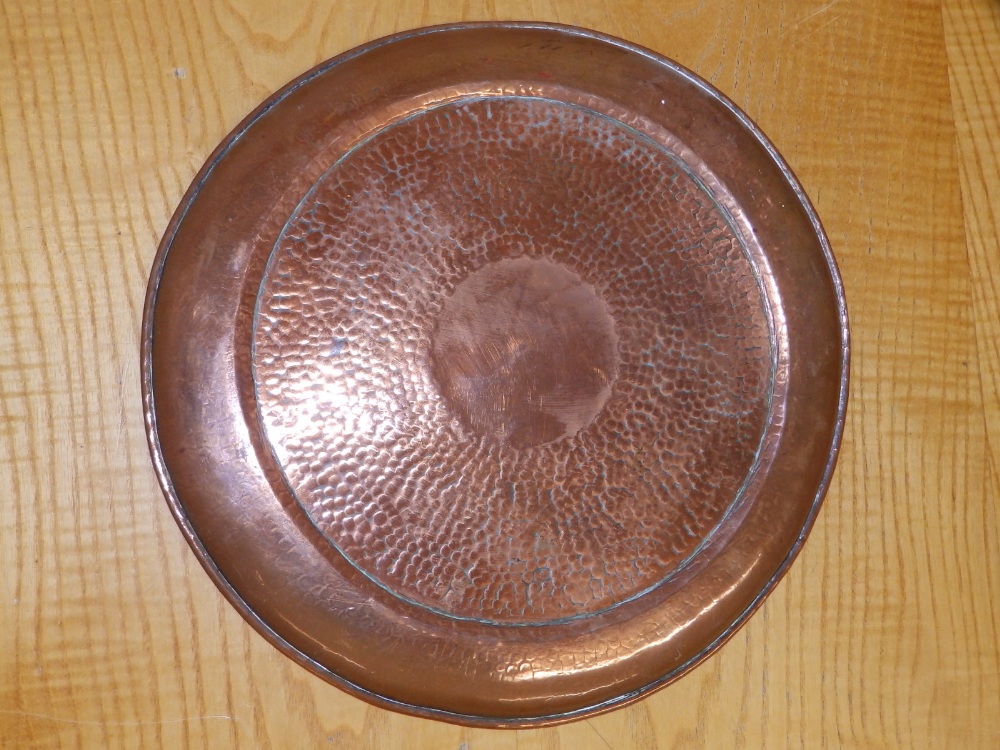 An embossed brass alms dish, 14" together with a beaten copper circular tray by H. Dyer, 11.5". (2) - Image 4 of 4