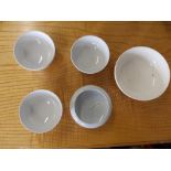 Five small Moorcroft plain white glazed bowls - three a/f.