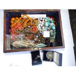 Two old boxes containing beads and costume jewellery