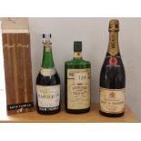 A boxed bottle of Alain Thomas Royal Brandy, a Burnett's London Dry Gin and a Moet Chandon