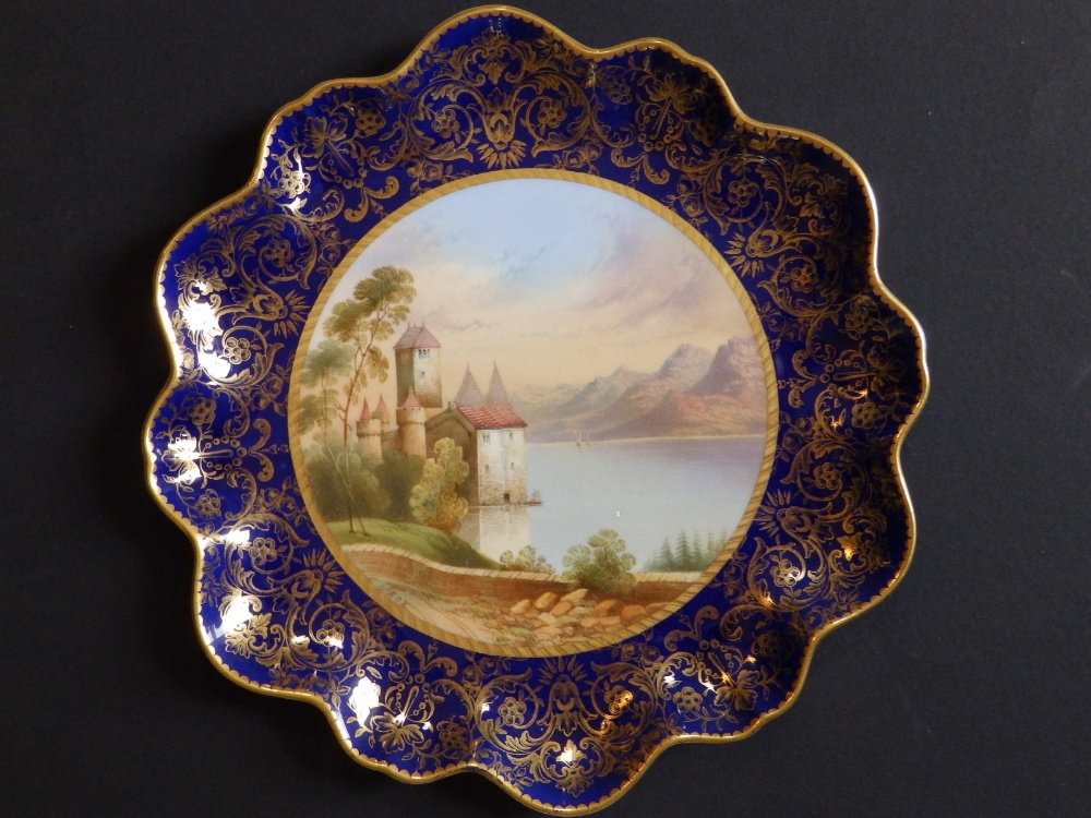 An Aynsley porcelain scallop edged plate, painted with a view of the 'Castle of Chillon,