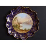 An Aynsley porcelain scallop edged plate, painted with a view of the 'Castle of Chillon,